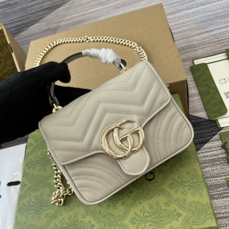 G*u*i top handle bags
